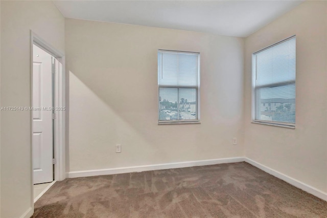 spare room featuring carpet flooring