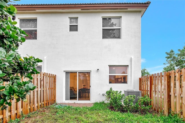 back of property with central air condition unit