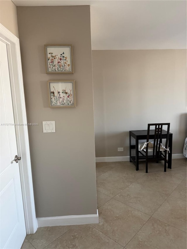 hallway featuring light tile patterned floors