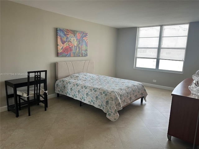 bedroom featuring light tile patterned floors