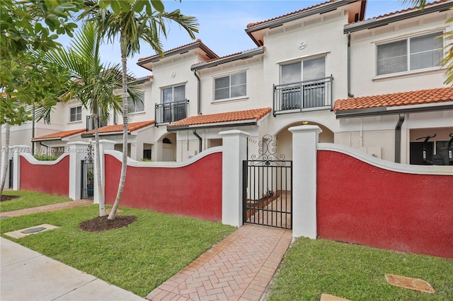 mediterranean / spanish home featuring a balcony