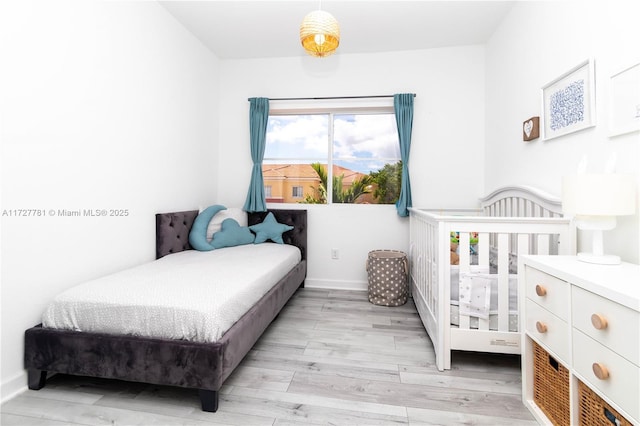 bedroom featuring light wood-type flooring