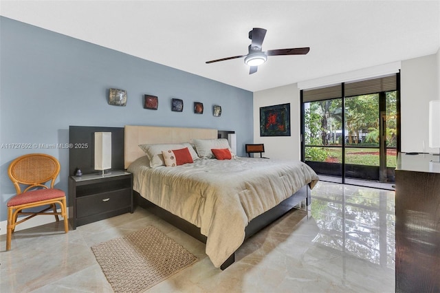 bedroom with ceiling fan, access to exterior, and expansive windows