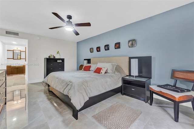 bedroom with ceiling fan and ensuite bathroom