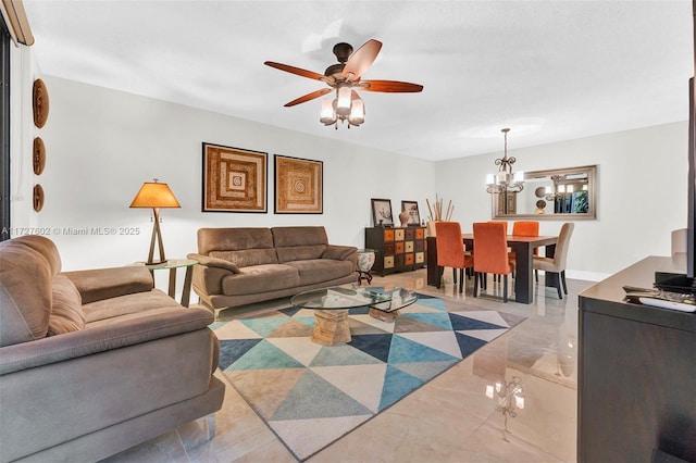 living room with ceiling fan with notable chandelier