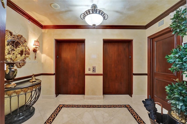 entryway with crown molding and elevator