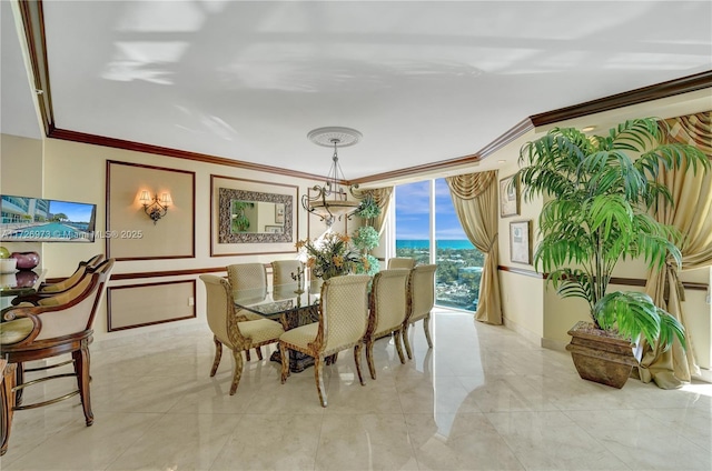 dining room featuring crown molding