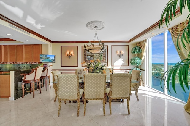 dining room with expansive windows and ornamental molding