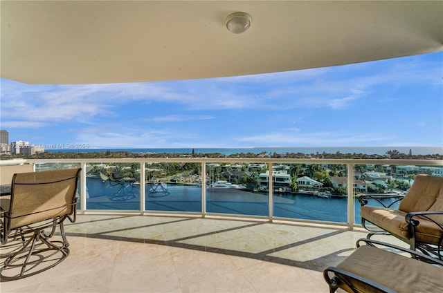 balcony featuring a water view