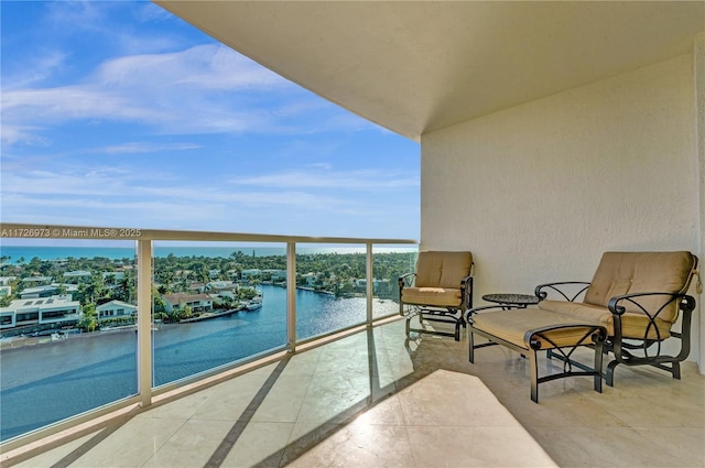 balcony featuring a water view