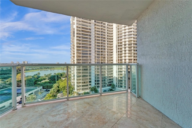 balcony featuring a water view