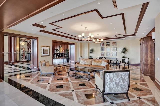 living room with crown molding, a notable chandelier, and a tray ceiling