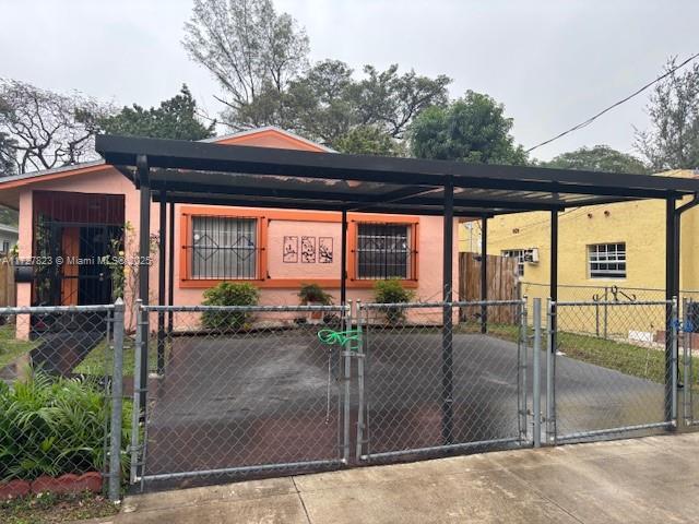 view of front of home with a carport