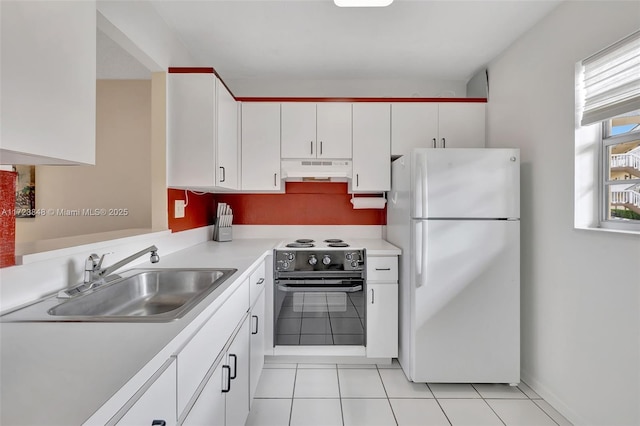 kitchen featuring white cabinets, white refrigerator, sink, electric range, and light tile patterned floors