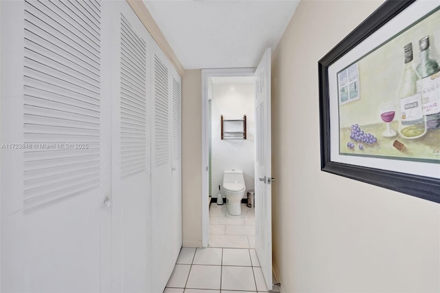 hallway with light tile patterned floors