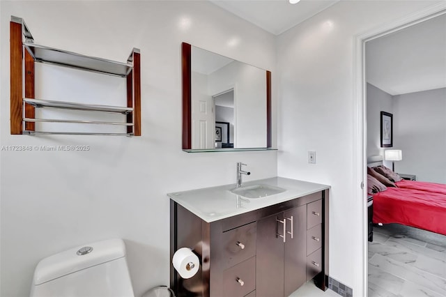 bathroom with toilet and vanity