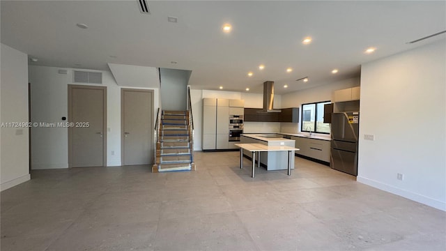 kitchen with a center island, a breakfast bar, fridge, island exhaust hood, and white cabinetry