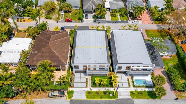 birds eye view of property with a residential view