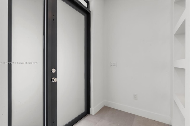 interior space featuring baseboards