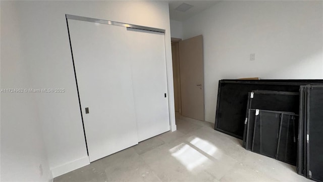 unfurnished bedroom with a closet