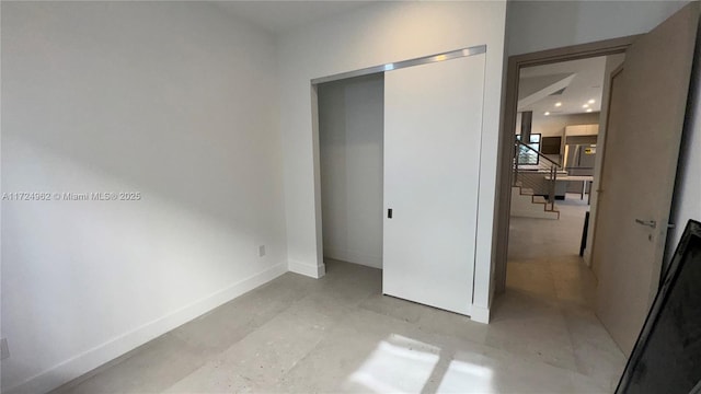 unfurnished bedroom featuring a closet