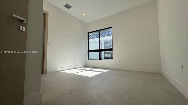 empty room with vaulted ceiling