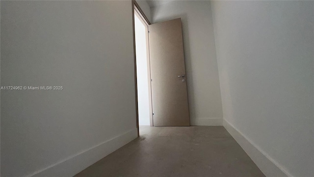 hallway featuring concrete flooring