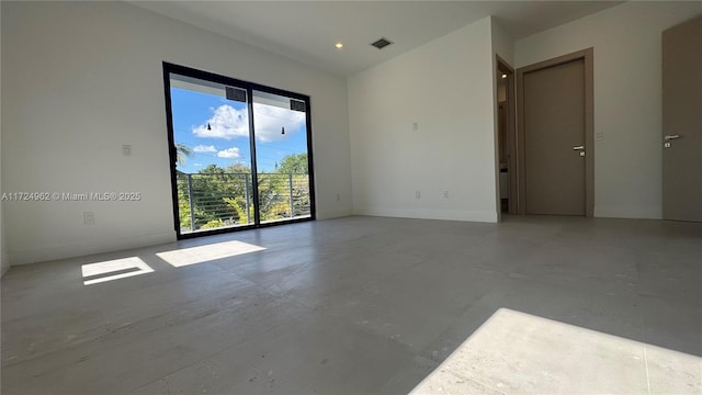 empty room featuring concrete flooring