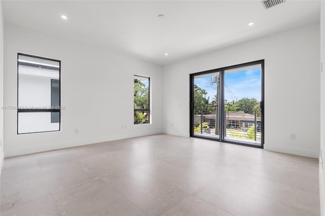 unfurnished room with visible vents, baseboards, and recessed lighting