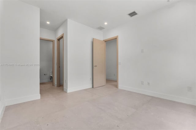 unfurnished bedroom with concrete flooring, visible vents, baseboards, and recessed lighting