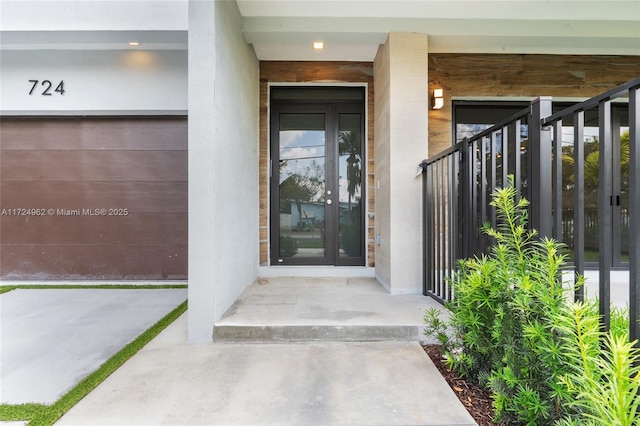 view of exterior entry with covered porch