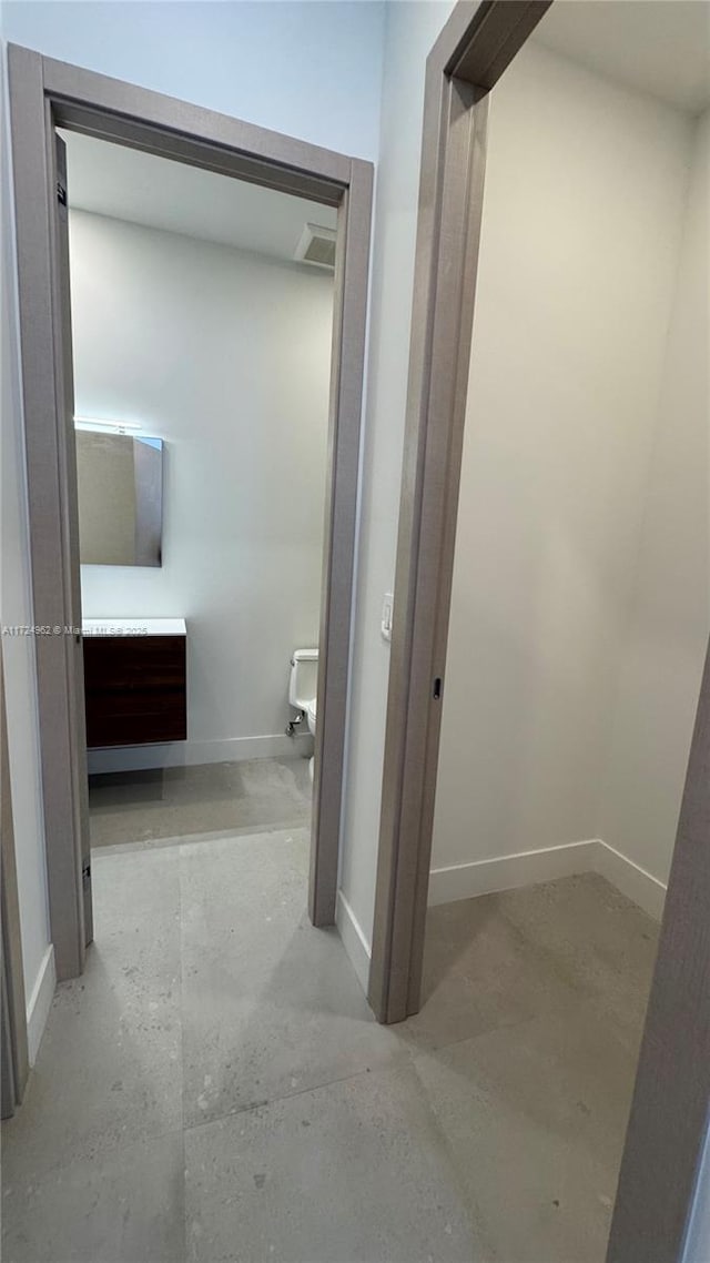 bathroom featuring concrete floors