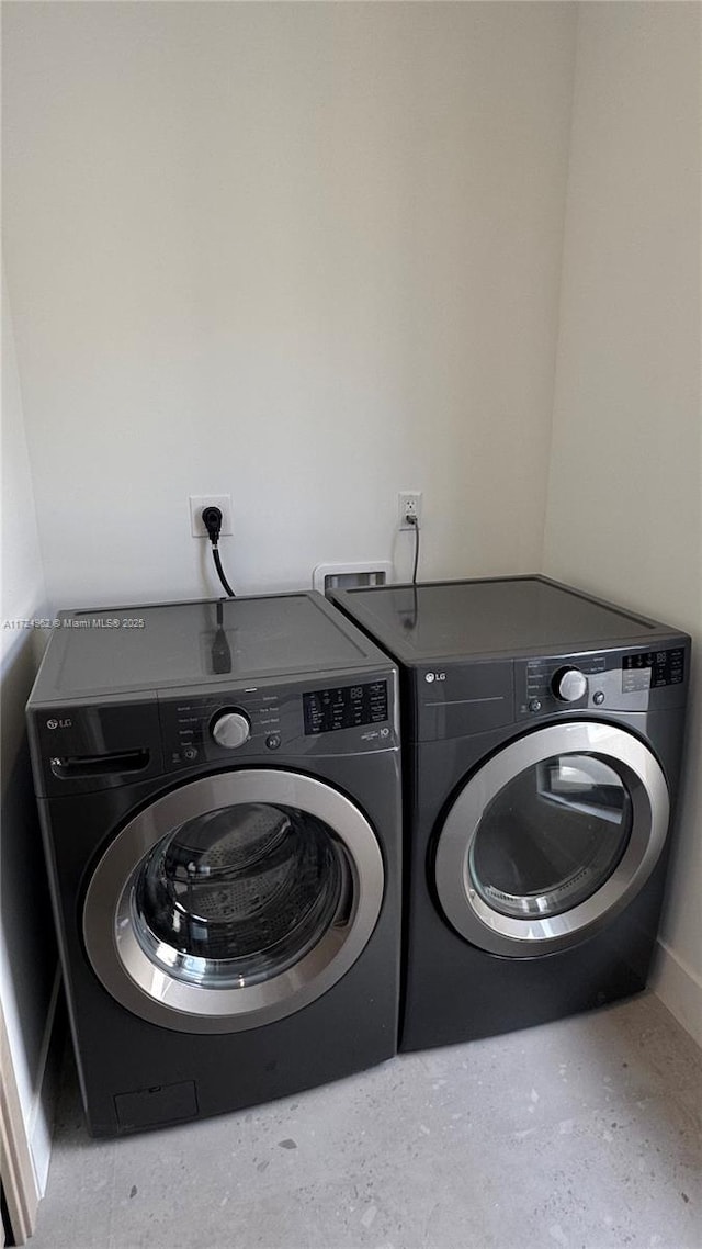 laundry area featuring washing machine and dryer