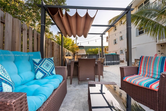 view of patio with exterior kitchen and an outdoor living space