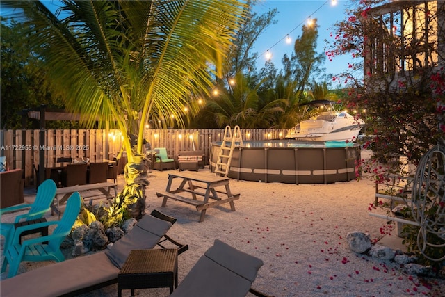 view of patio featuring a fenced in pool and an outdoor hangout area