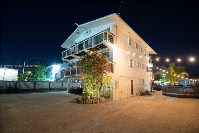 view of property exterior at night