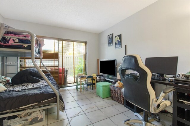 bedroom featuring light tile patterned floors