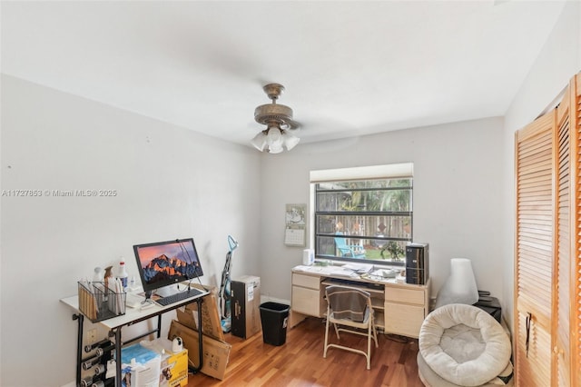 office area with ceiling fan and light hardwood / wood-style floors