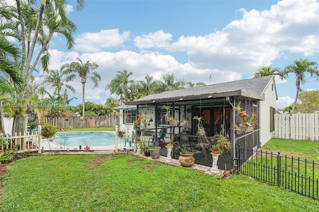 view of pool with a lawn