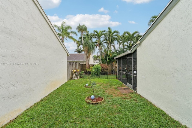 view of yard with a sunroom