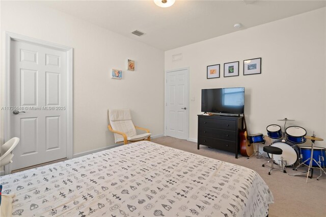 bedroom featuring light colored carpet