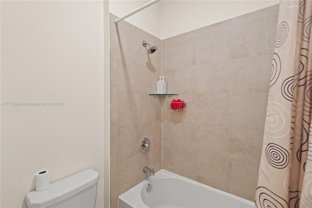 bathroom featuring toilet and shower / bath combination with curtain