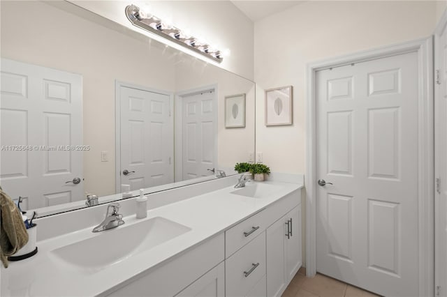 bathroom featuring tile patterned floors and vanity