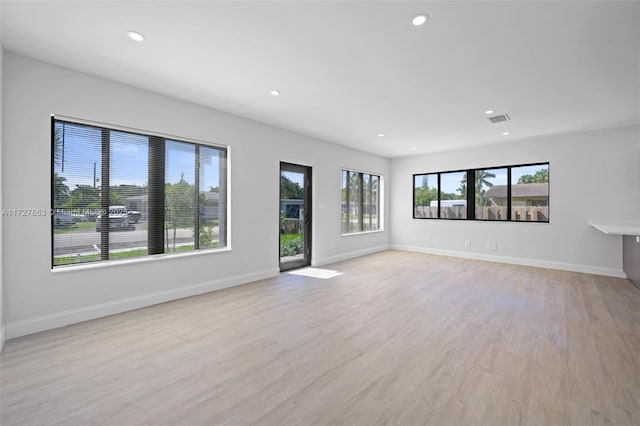 unfurnished living room with light wood-type flooring