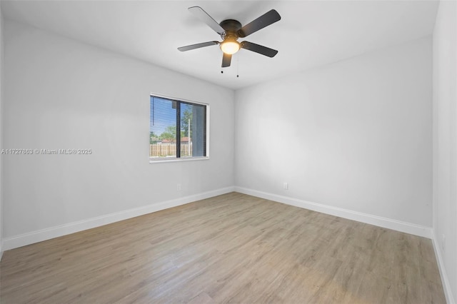 spare room with ceiling fan and light hardwood / wood-style floors