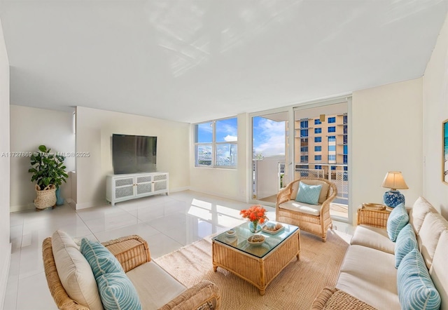 430 Golden Isles Dr Unit 707, Hallandale Beach, FL 33009 - living room with tile patterned floors and baseboards