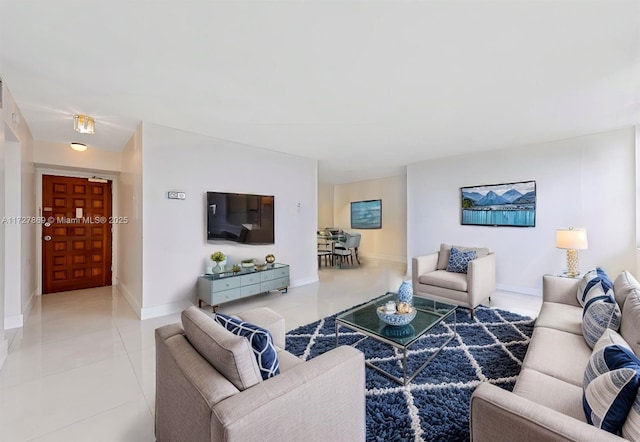 430 Golden Isles Dr Unit 707, Hallandale Beach, FL 33009 - tiled living area with baseboards