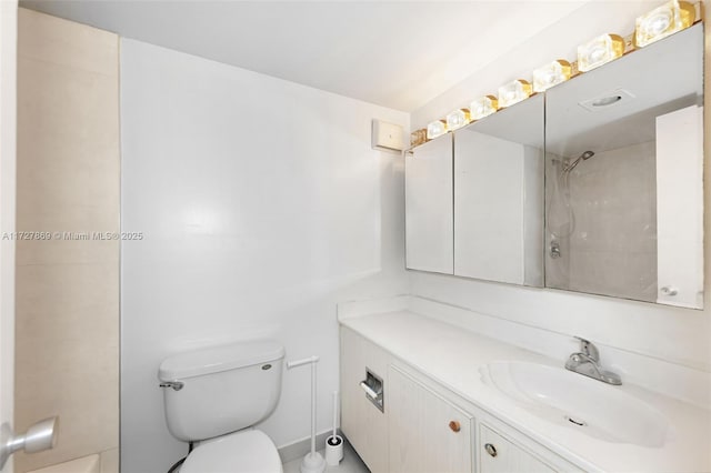 bathroom with toilet and vanity