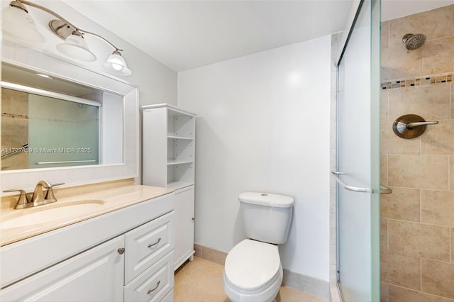 bathroom featuring an enclosed shower, vanity, tile patterned floors, and toilet