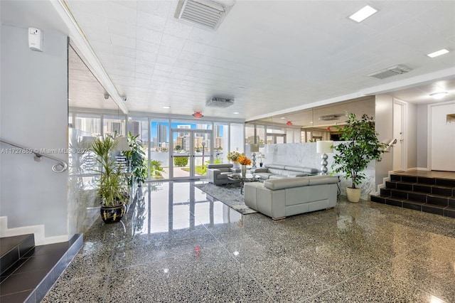 common area featuring visible vents and stairway